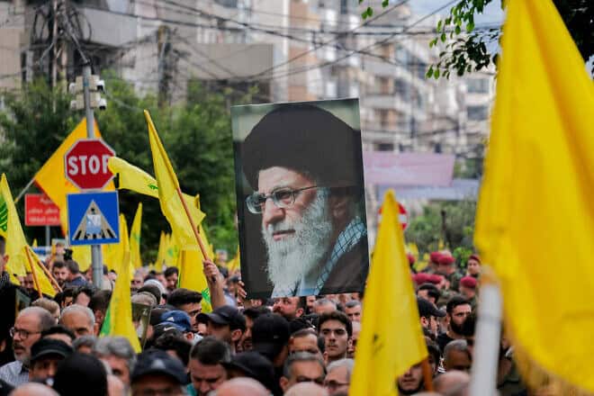 Hezbollah supporters at a funeral of terrorists in the southern suburb of Dahiyeh in Beirut, Sept. 22, 2024. Photo by Courtney Bonneau/Middle East Images/AFP via Getty Images.