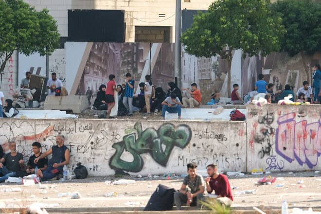 Lebanese displaced by the fighting between Israel and Hezbollah gather along the Lebanese capital's seaside corniche in Beirut on Sept. 28, 2024. Photo by Courtney Bonneau/Middle East Images/AFP via Getty Images.