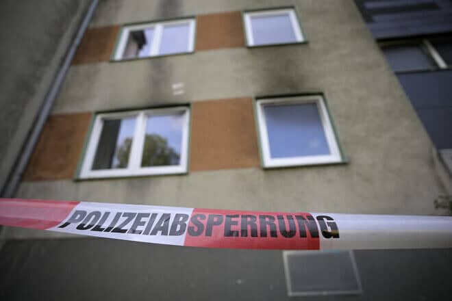 A police cordon is i front of an apartment building in Essen, western Germany, on Sept. 29, 2024, the day after a fire broke out at the building. A 41-year-old Syrian suspect has been arrested after fires broke out at two apartment blocks and a van was rammed into shops in the western Germany city of Essen, police said on Sept. 29. Photo by Sascha Schuermann/AFP via Getty Images.