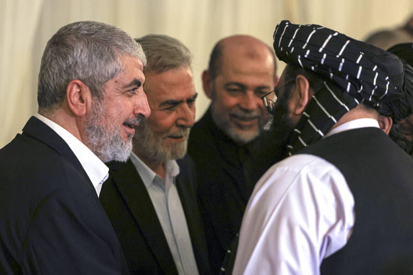 Hamas senior official Khaled Meshaal (left) and Ziyad al-Nakhalah (second from left), secretary-general of the Palestinian Islamic Jihad movement, at the funeral of Hamas political leader Ismail Haniyeh (who was assassinated in Tehran on July 31) in the Qatari capital of Doha, Aug. 2, 2024. Photo by Mahmud Hams/AFP via Getty Images.