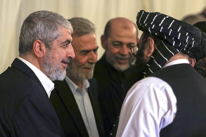 Hamas senior official Khaled Meshaal (left) and Ziyad al-Nakhalah (second from left), secretary-general of the Palestinian Islamic Jihad movement, at the funeral of Hamas political leader Ismail Haniyeh (who was assassinated in Tehran on July 31) in the Qatari capital of Doha, Aug. 2, 2024. Photo by Mahmud Hams/AFP via Getty Images.