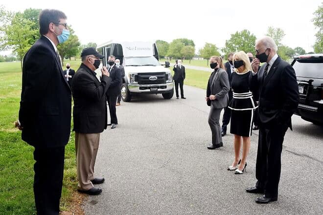 Democratic presidential candidate and former U.S. Vice President Joe Biden and his wife, Jill Biden, speak to Matt Meyer (left), county executive of New Castle County, and General Francis D. Vavala on Memorial Day at Delaware Memorial Bridge Veteran's Memorial Park in New Castle, Del., May 25, 2020. Photo by Oliver Douliery/AFP via Getty Images.