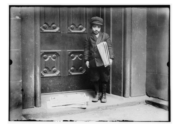 Newsboy in the United States, circa 1913. Photo by Lewis Wickes Hine, part of the Prints & Photographs Online Catalog at the Library of Congress.