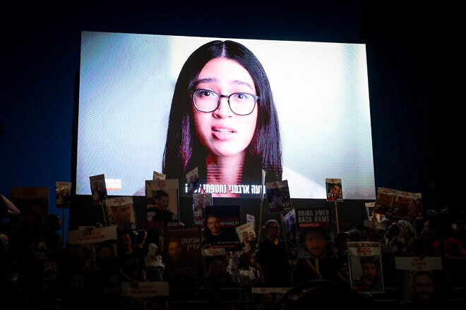 Released hostage Noa Argamani speaks on a screen during a rally in Tel Aviv calling for the release of others still being held captive by Hamas terrorists in the Gaza Strip, June 29, 2024. Photo by Avshalom Sassoni/Flash90.