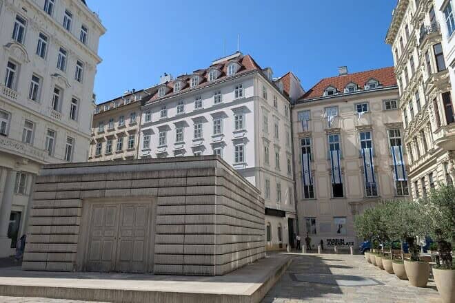Judenplatz, the town square in Vienna's Innere Stadt that was the center of Jewish life in the Middle Ages. The Memorial to the Austrian Jewish Victims of the Shoah is seen in the foreground and the Museum Judenplatz in the background, Vienna, Austria, Aug. 25, 2024. Photo by Michal Eliasy Marks.