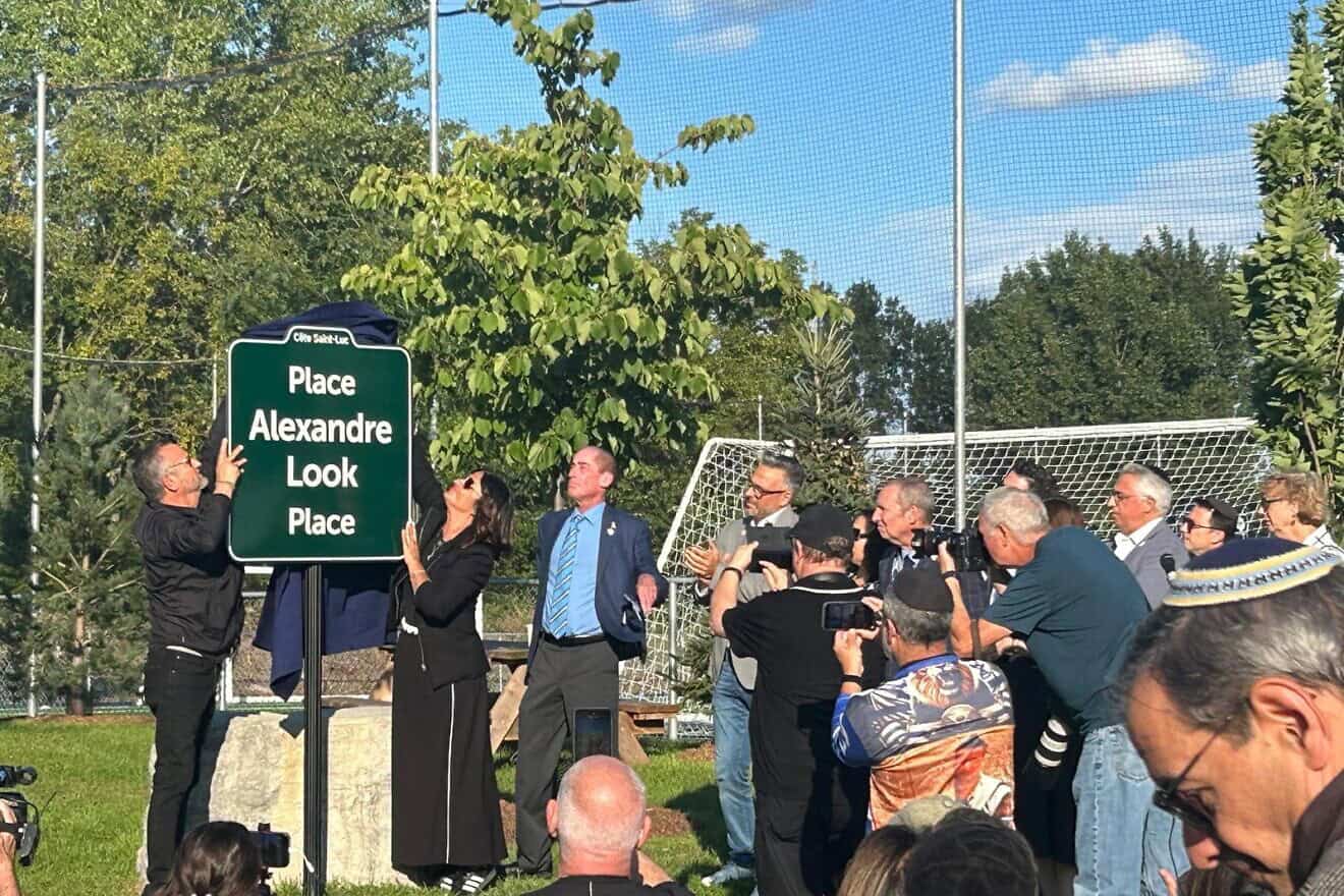 Alain and Raquel Ohnona Look uncover the plaque bearing the name of their son Alex, murdered by Hamas on Oct. 7, 2023, in Montreal, Canada. Photo: Amelie Botbol.