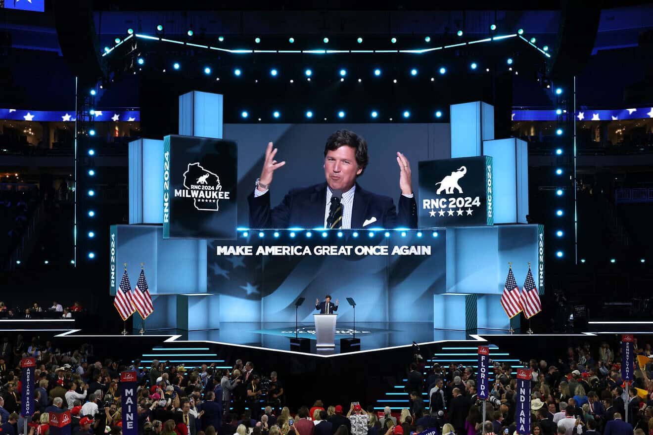 Tucker Carlson, the former “Fox News” cable-TV host ho now has his own show, speaks on stage on the fourth day of the Republican National Convention at the Fiserv Forum in Milwaukee on July 18, 2024. Photo by Chip Somodevilla/Getty Images.