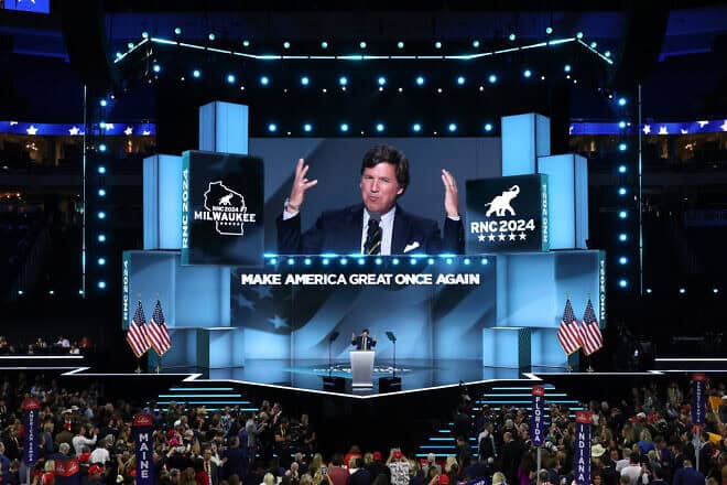 Tucker Carlson, the former “Fox News” cable-TV host ho now has his own show, speaks on stage on the fourth day of the Republican National Convention at the Fiserv Forum in Milwaukee on July 18, 2024. Photo by Chip Somodevilla/Getty Images.
