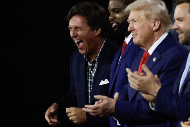 From left: Tucker Carlson, Rep. Byron Donalds (R-Fla.), current Republican presidential candidate and former President Donald Trump, and Republican Vice Presidential candidate Sen. J.D. Vance (R-Ohio) on the first day of the Republican National Convention at the Fiserv Forum in Milwaukee on July 15, 2024. Photo by Chip Somodevilla/Getty Images.