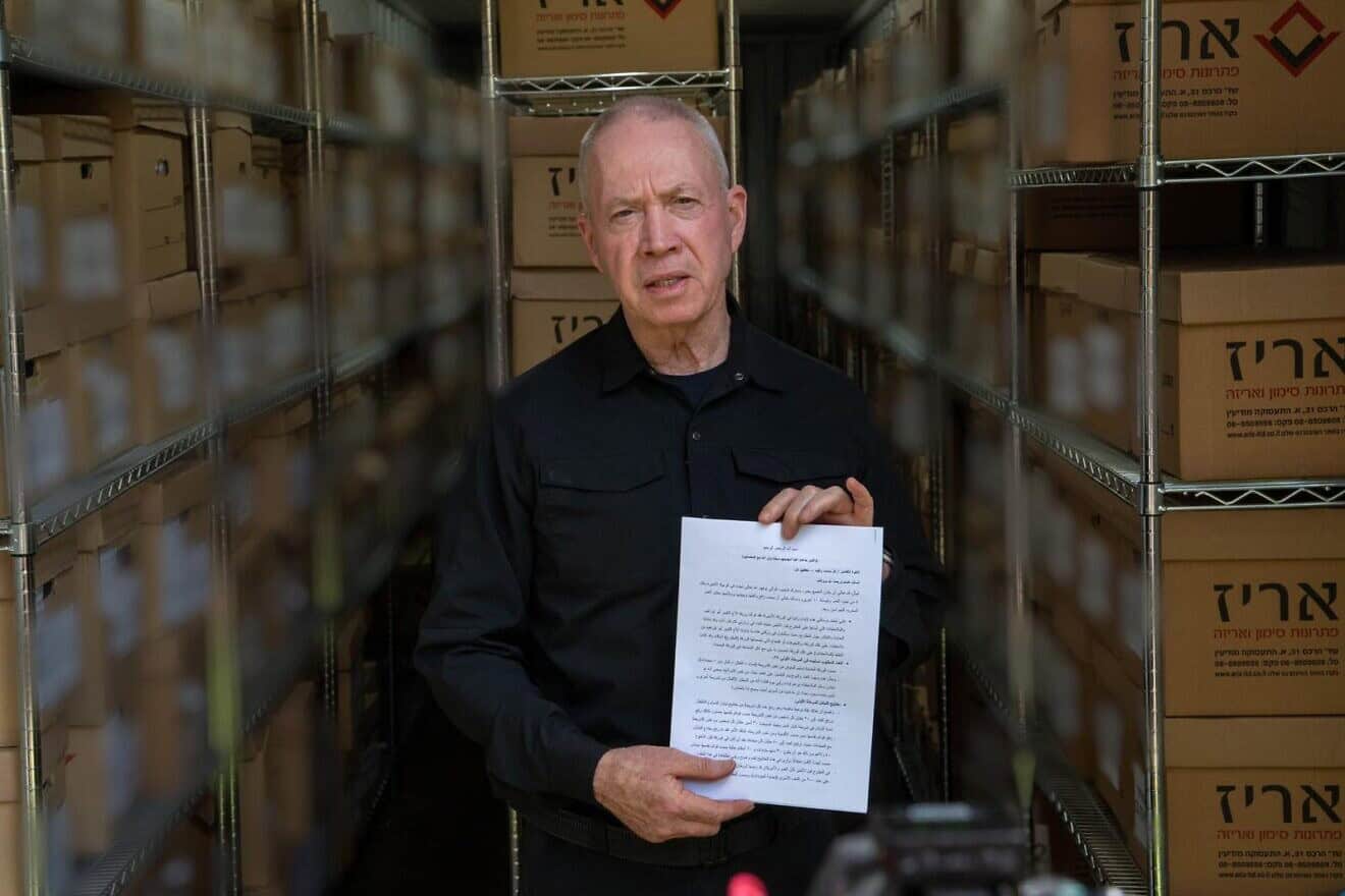 Israeli Defense Minister Yoav Gallant holds a document written by the former commander of Hamas's Khan Younis Brigade, Rafa'a Salameh, at an IDF intelligence base in central Israel, Sept. 11, 2024. Photo by Ariel Hermoni/Defense Ministry.