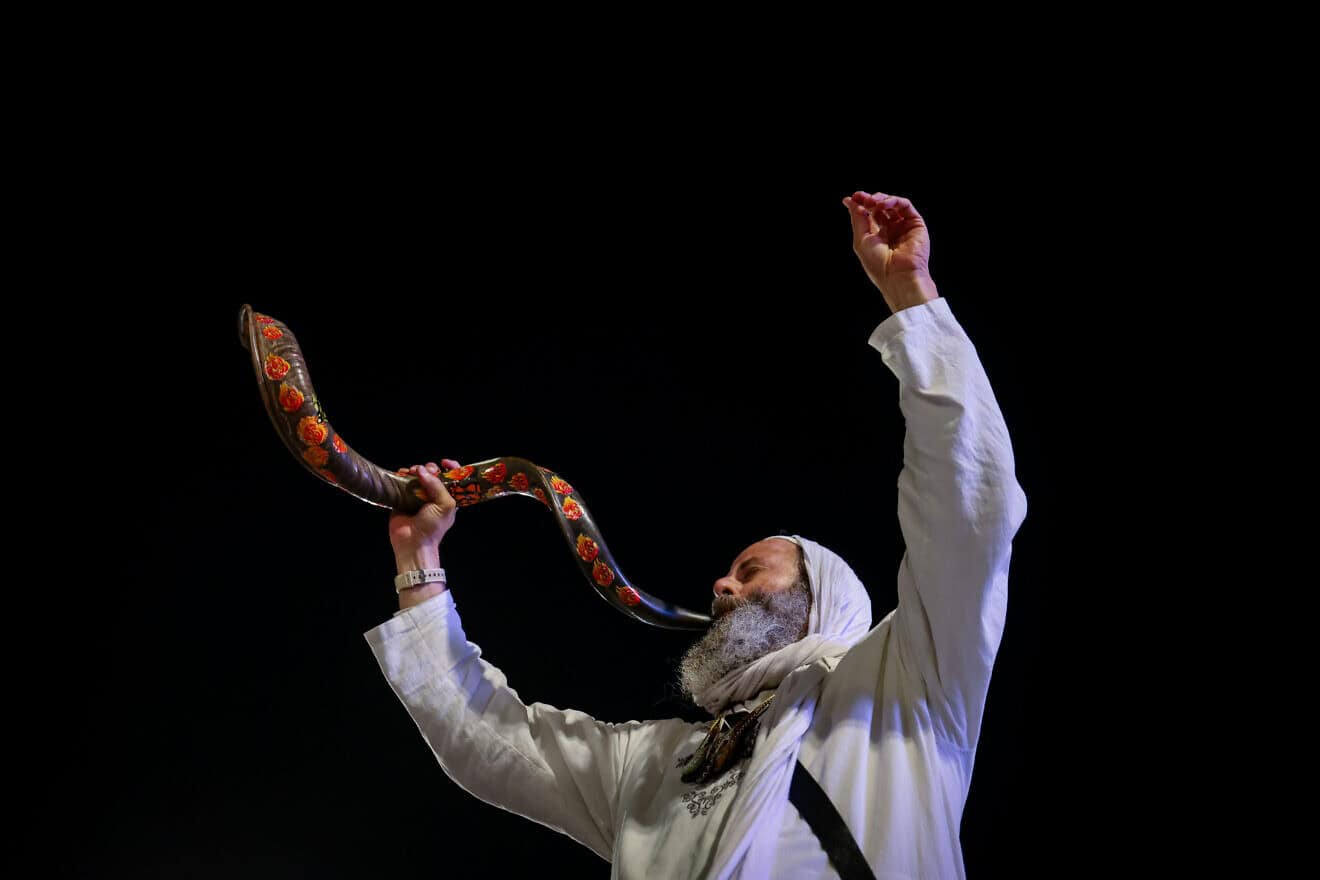 The blowing of the shofar as Jews arrive for Selichot penitential prayers at the Western Wall Plaza in Jerusalem two days before Yom Kippur, Oct. 9, 2024. Photo by Chaim Goldberg/Flash90.