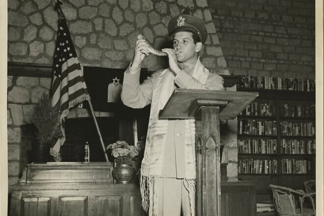 U.S. Chaplain Joseph H. Freedman of the U.S. Army Forces in the Middle East blows the shofar during Rosh Hashanah. Photo by Sgt. E.M. Henderson/S.C., Signal Corps. via the Center for Jewish History.
