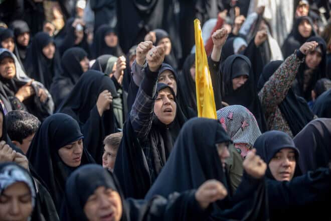 Iranians chant as they gather to listen to Supreme Leader Ali Khamenei's sermon at the Imam Khomeini Grand Mosalla mosque in Tehran on Oct. 4, 2024. Photo by Majid Saeedi/Getty Images.
