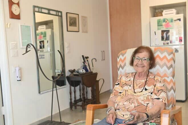 Mika Gelber sits in her living room in Herzliya, Israel, on Oct. 14, 2024. Photo by Canaan Lidor.