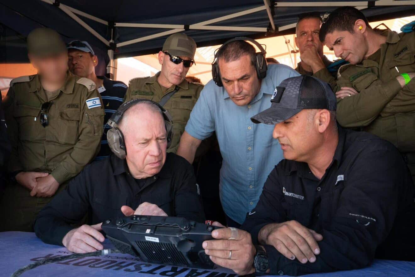 Minister of Defense Yoav Gallant views a controller screen during drone interception tests, Oct. 14, 2024. Photo by Ariel Hermoni/Ministry of Defense.