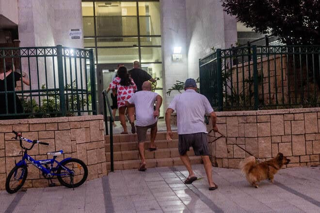 Israelis run for shelter during a rocket alert in Ashkelon, Aug. 6, 2022. Photo by Yonatan Sindel/Flash90.