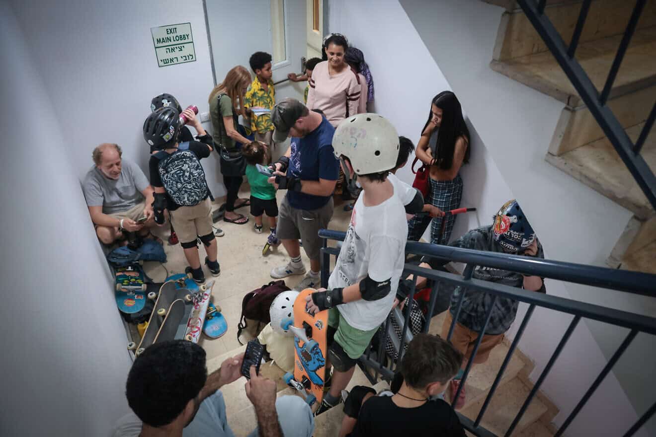 Israelis take cover inside a bomb shelter as an air-raid siren sounds in Tel Aviv, Oct. 26, 2023. Photo by Noam Revkin Fenton/Flash90.