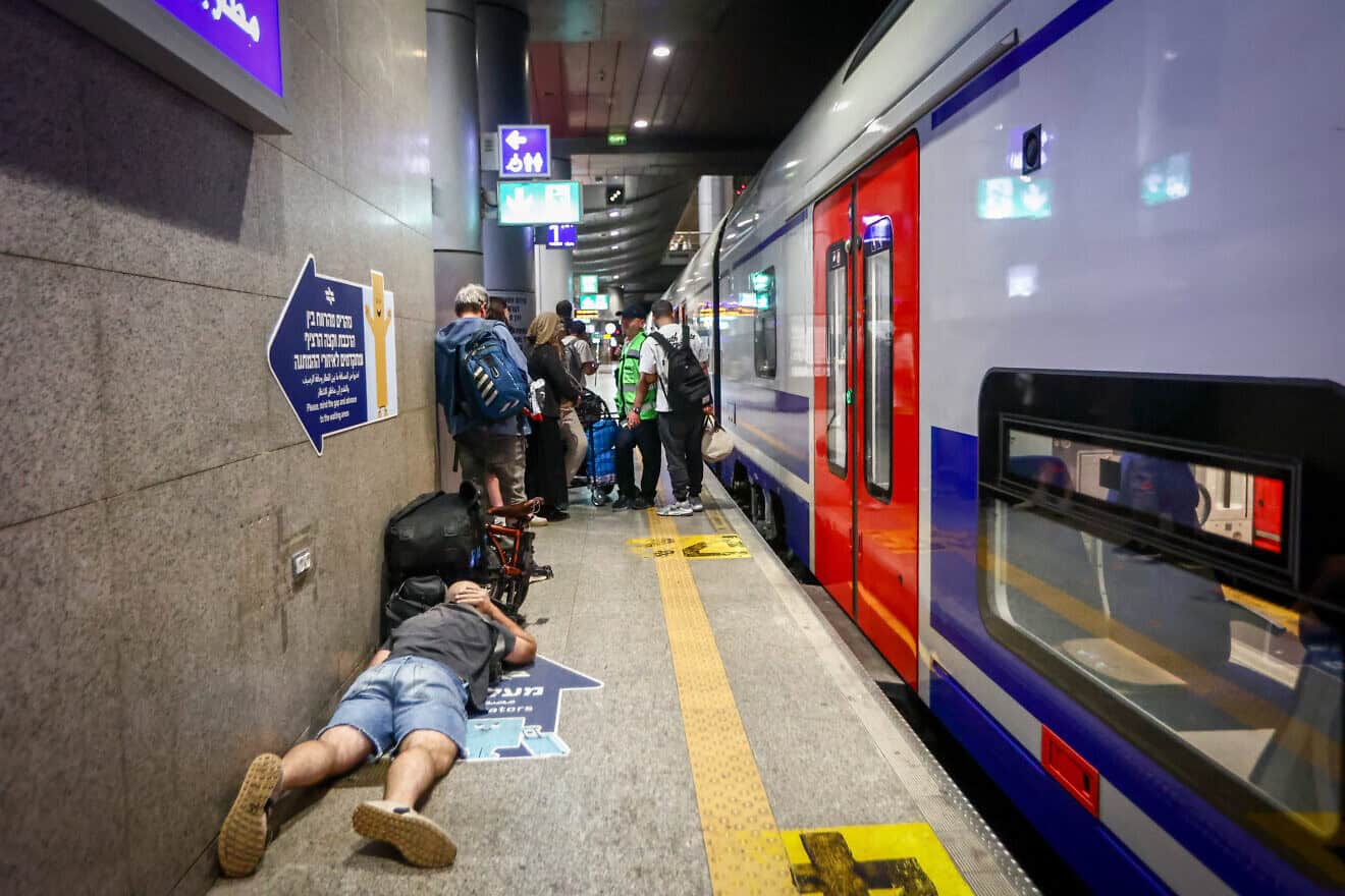 Israelis take cover inside a bomb shelter at the Ben Gurion airport as a siren alert is sounded in Tel Aviv, Oct. 1, 2024. Photo by Dor Pazuelo/Flash90.