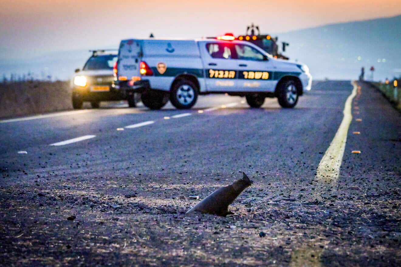 Israeli security forces at the site where a missile fired from Lebanon hit a road near the northern Israeli city of Katzrin, Oct. 4, 2024. Photo by Michael Giladi/Flash90.