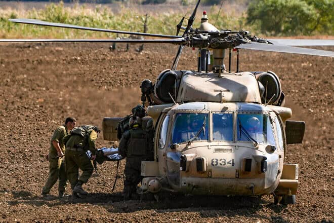 Israeli soldiers evacuate an individual wounded by a missile from Lebanon, near the Israel-Lebanon border, Oct. 22, 2024. Photo by Ayal Margolin/Flash90.
