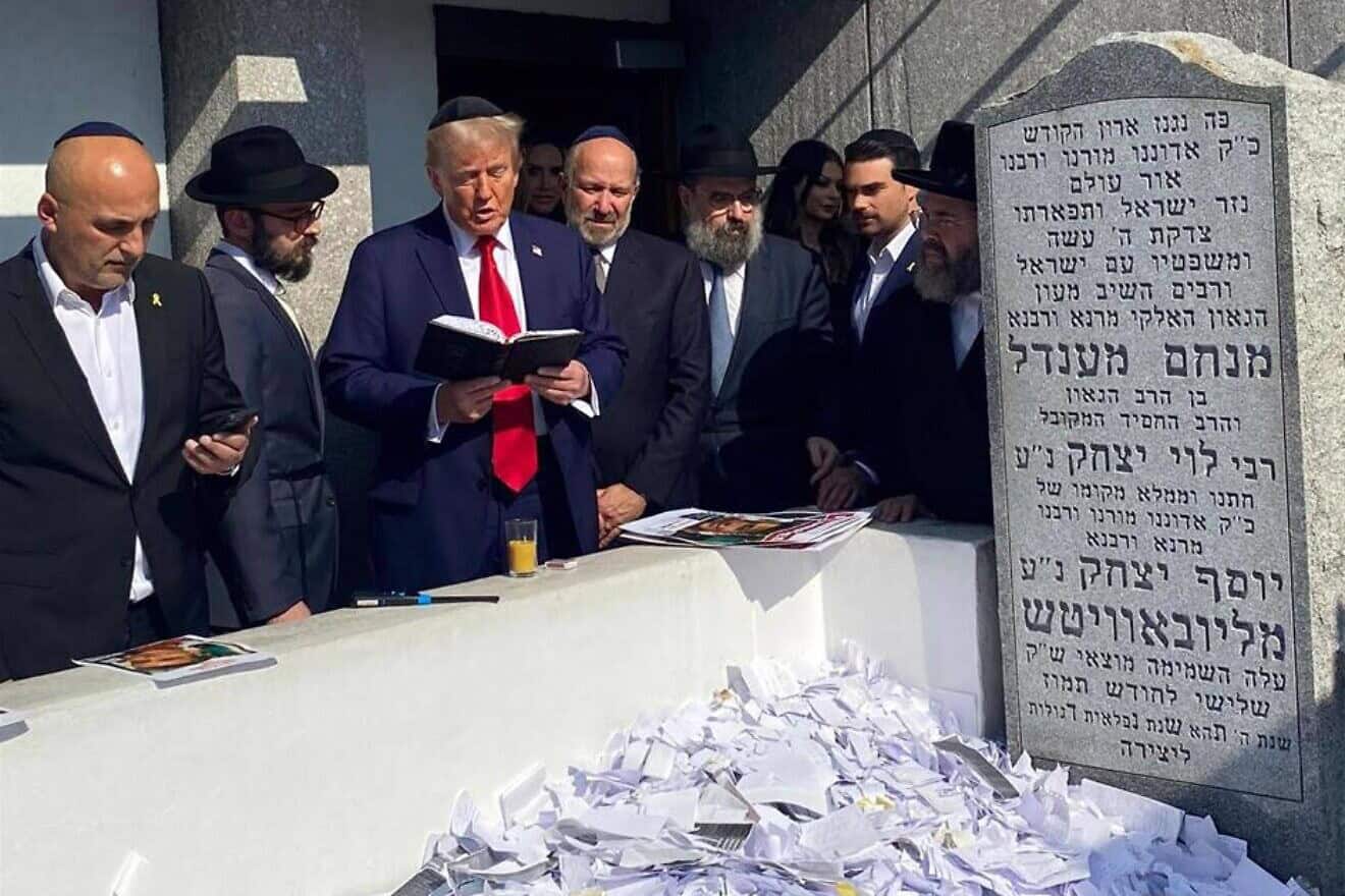 Former President Donald Trump, accompanied by rabbis from the Chabad-Lubavitch movement, prays at the Rebbe's Ohel in Queens, N.Y. Photo by Shabbos Kestenbaum/Chabad.org.