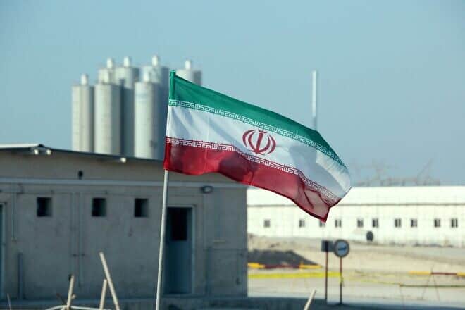 An Iranian flag in at the Bushehr nuclear power plant during a ceremony to kick-start works on a second reactor at the facility on Nov. 10, 2019. Photo by Atta Kenare/AFP via Getty Images.