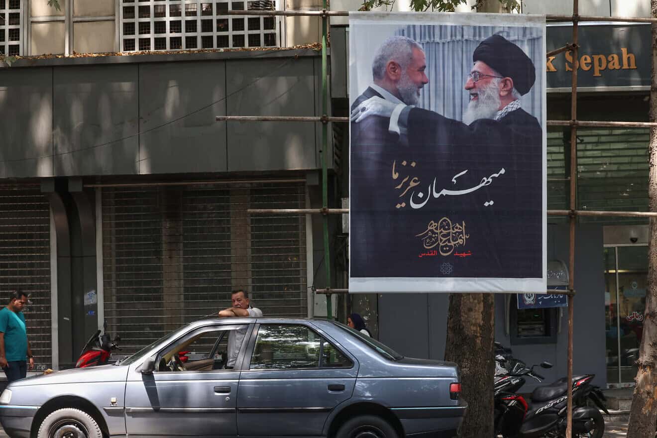 A poster of Iranian supreme leader Ayatollah Ali Khamenei (R) and slain Palestinian Hamas leader Ismail Haniyeh in Iran's capital Tehran on Aug. 10, 2024. Photo by Atta Kenare/AFP via Getty Images.
