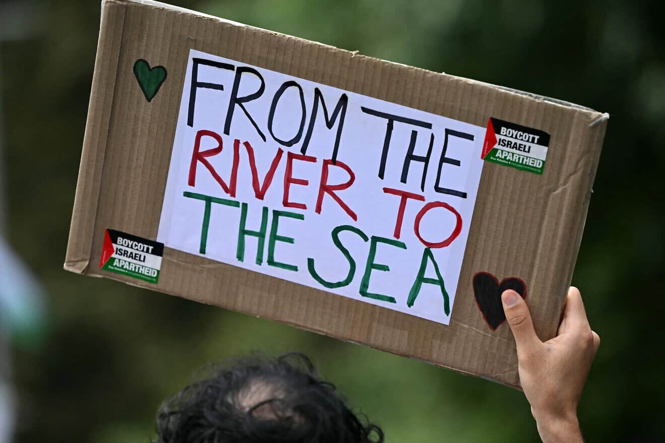 A pro-Palestinian activist holds a placard reading “From the river to the sea" as they march through London during a "National Day of Action for Palestine“ on Sept. 7, 2024. Photo by Justin Tallis/AFP via Getty Images.