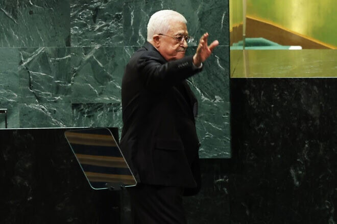 Palestinian Authority leader Mahmoud Abbas waves as he leaves the stage during the U.N. General Assembly annual general debate in New York, Sept. 26, 2024. Photo by Michael M. Santiago/Getty Images.