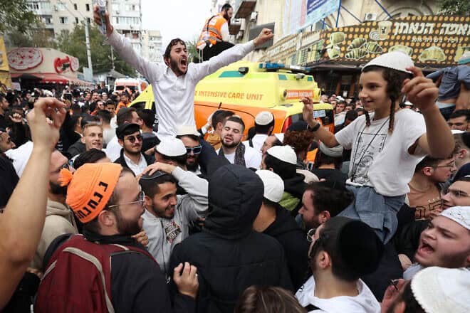 Jewish pilgrims pray on a street next to the tomb of Rabbi Nachman ahead of the Jewish new year of "Rosh Hashanah", in Uman, central Ukraine, on Oct. 2, 2024, amid the Russian invasion in Ukraine. Photo by Anatolii Stepanov/AFP via Getty Images.
