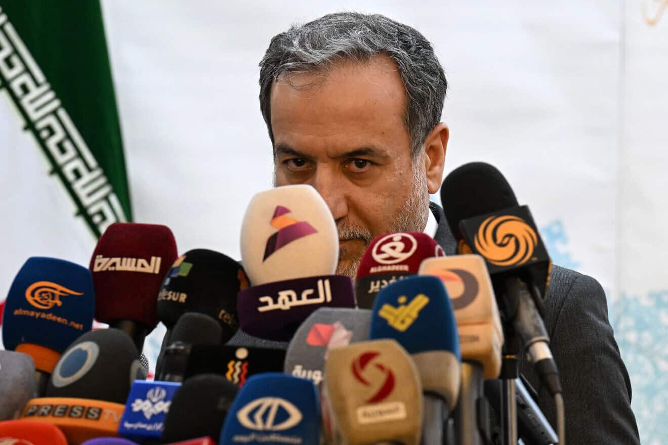 Iranian Foreign Minister Abbas Araghchi speaks to the press after meeting with Syrian officials at Tehran's embassy in Damascus, Oct. 5, 2024. Photo by Louai Beshara/AFP via Getty Images.