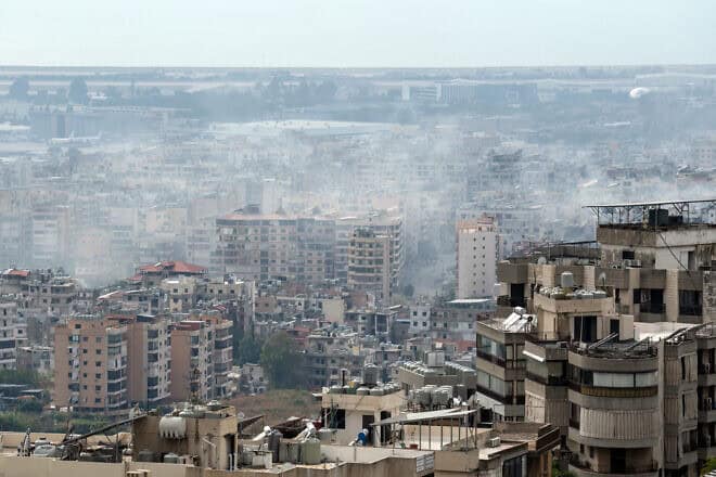 Smoke rises in the Hezbollah terrorist stronghold of Dahiyeh following Israeli airstrikes, Oct. 6, 2024. Photo by Carl Court/Getty Images.