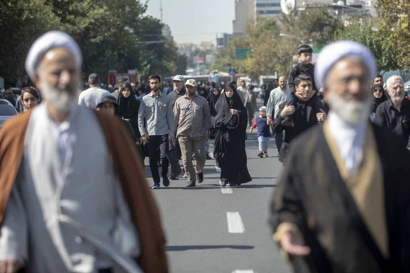 Iranians on the way to Friday prayers on Oct. 4, 2024 in Tehran, Iran. Photo by Majid Saeedi/Getty Images.