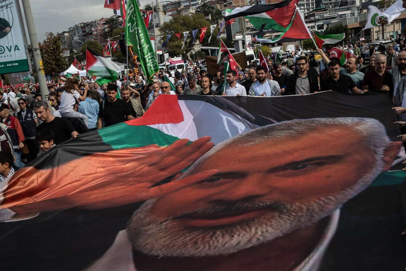 People carry a portrait of late Hamas leader Ismail Haniyeh during a protest in Istanbul Turkey on the eve of the first anniversary of the Oct. 7, 2023 terrorist attacks, Oct. 6, 2024. Photo by Burak Kara/Getty Images.
