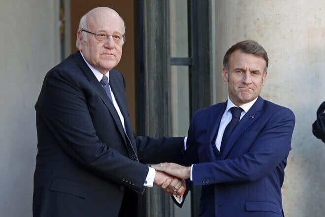 French President Emmanuel Macron (left) welcomes Lebanese Prime Minister Najib Mikati to Paris on Oct. 23, 2024. Photo by Chesnot/Getty Images.