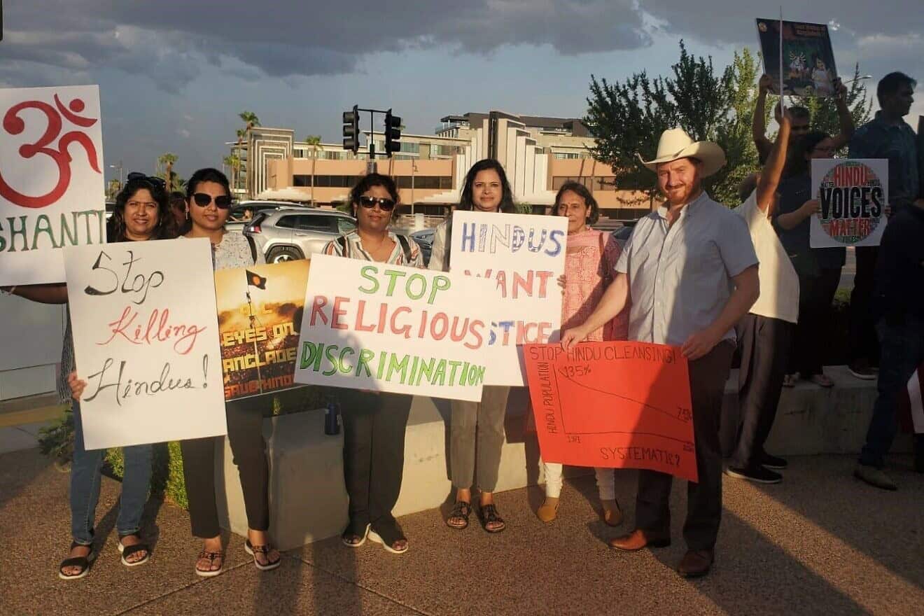 “Rally for Awareness of anti-Hindu genocide in Bangladesh”: Hindu ACTion led a team of community organizations (Anjalee Swamy is third from the right, and Jake Bennett is at far-right) that included Hindus of Bangladesh, Hindus of Arizona, AZ Sanatani, Foundation for Indian and Indian Diaspora Studies and the Israeli-American Coalition for Action (IAC for Action) in Scottsdale, Ariz., on Aug. 23, 2024. Credit: Courtesy.