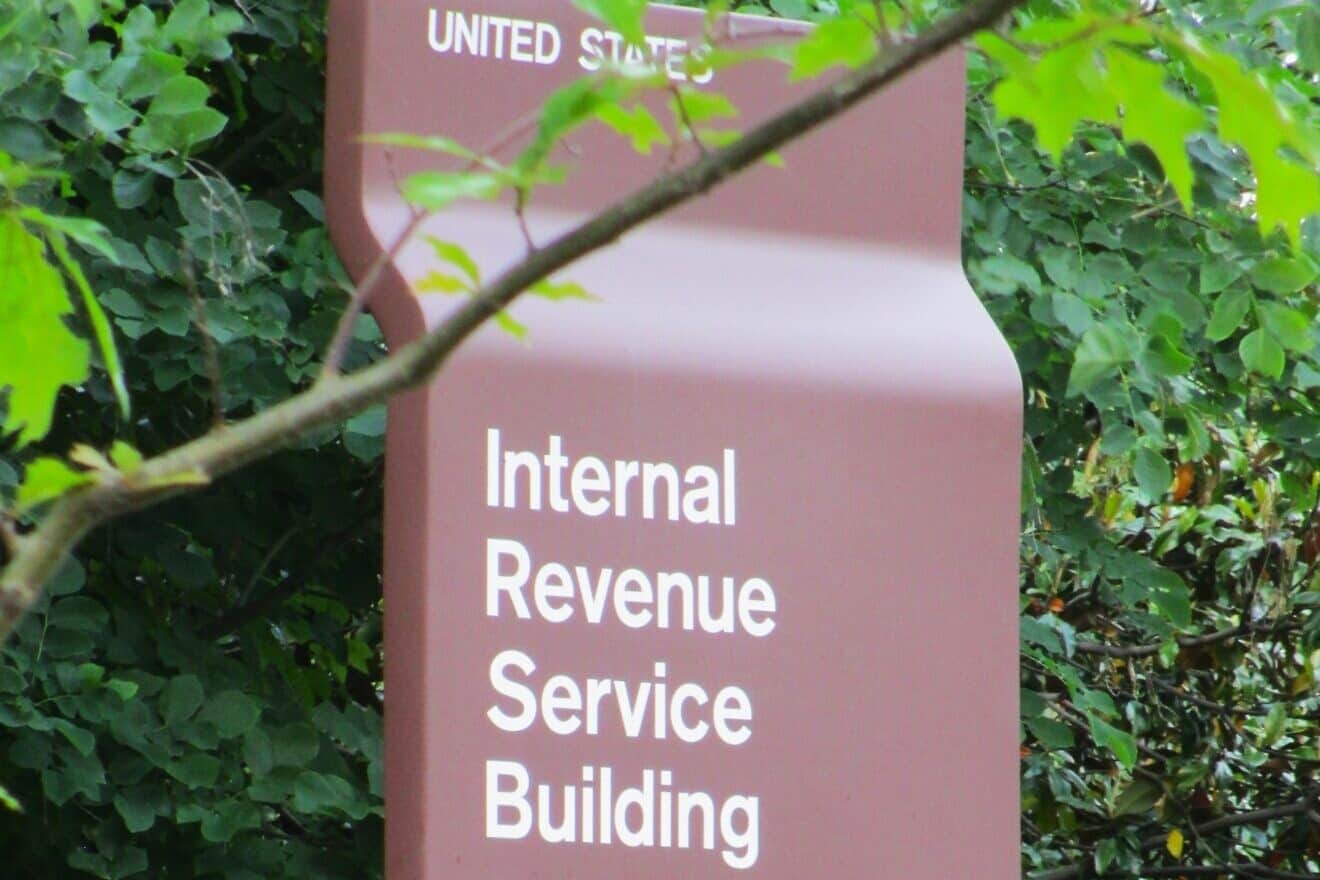 Entry sign to IRS building. Credit: Joshua Doubek via Wikimedia Commons.