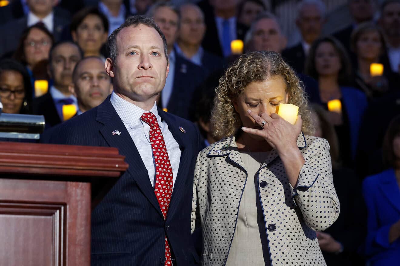 Rep. Josh Gottheimer (D-N.J.) and Rep. Debbie Wasserman Schultz (D-Fla.), both Jewish, listen as Margaret Grun Kibben, the chaplain of the U.S. House of Representatives, leads a prayer during a vigil for Israel on the steps of the U.S. Capitol Building in Washington, D.C., on Oct. 12, 2023.  Photo by Anna Moneymaker/Getty Images.