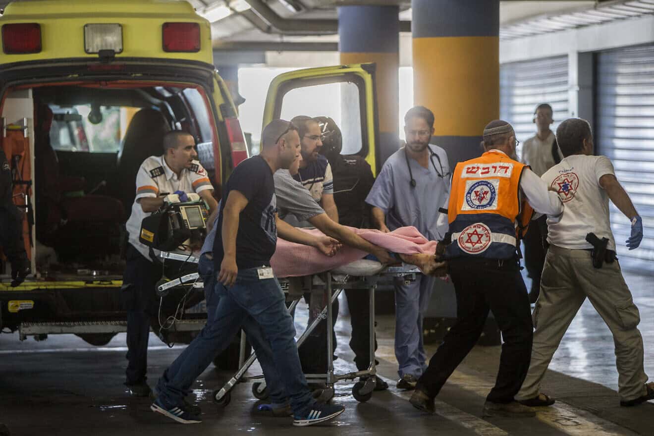 Medics take a 13-year-old girl, seriously wounded by a terrorist in Kiryat Arba in Judea, to the emergency room at Shaare Zedek Medical Center in Jerusalem on June 30, 2016. Photo by Yonatan Sindel/Flash90.