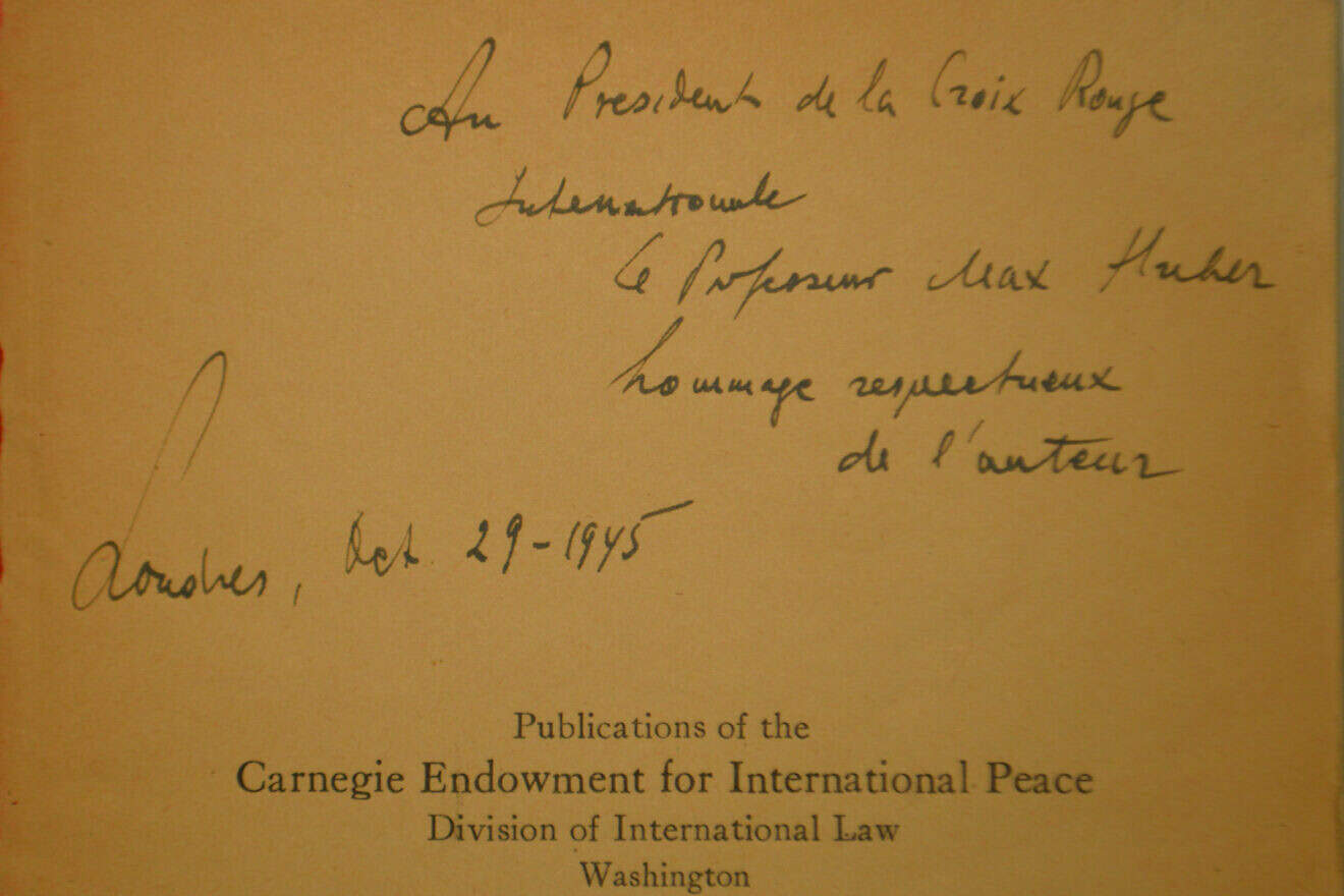 A handwritten dedication by Raphael Lemkin in a copy of his 1944 book “Axis Rule in Occupied Europe,” which defined the term genocide, to Max Huber, president of the International Committee of the Red Cross (ICRC), dated Oct. 29, 1945. Credit: Roman Deckert/Preserved in the ICRC Library.