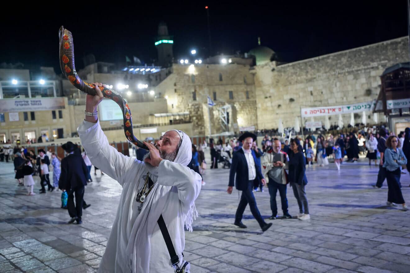 The blowing of the shofar as Jews arrive for Selichot penitential prayers at the Western Wall Plaza in Jerusalem two days before Yom Kippur, Oct. 9, 2024. Photo by Chaim Goldberg/Flash90.
