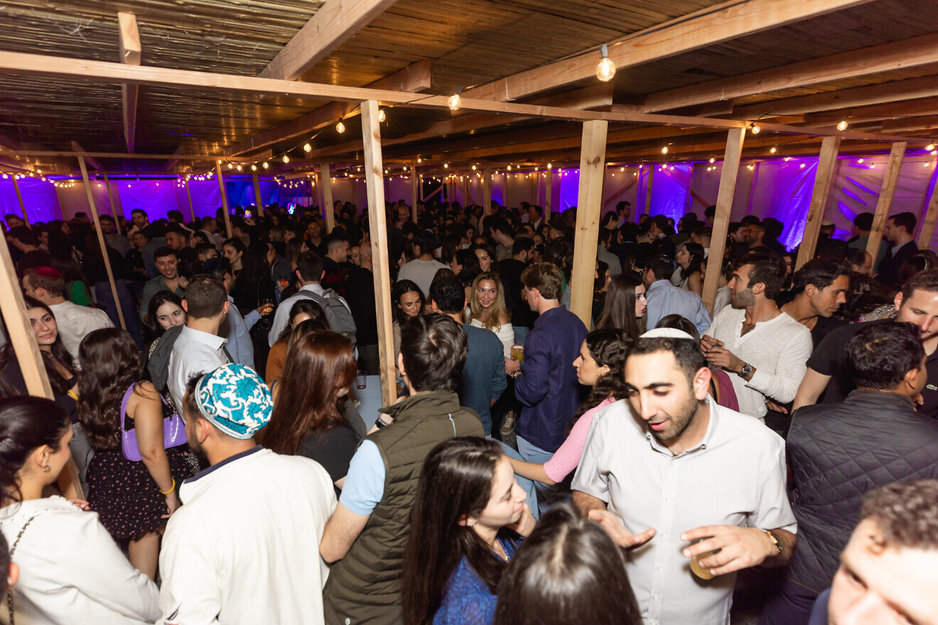 Thousands of young Jews gathered in a 5,000-foot sukkah to celebrate the Jewish holiday in Midtown Manhattan on Oct. 21, 2024. Credit: Samii Stoloff Photography/Chabad Young Professionals.