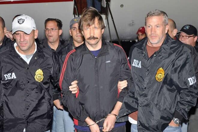 Viktor Bout, a Russian arms dealer known as the “Merchant of Death,” escorted by U.S. federal agents, Nov. 16, 2010. Credit: DEA.