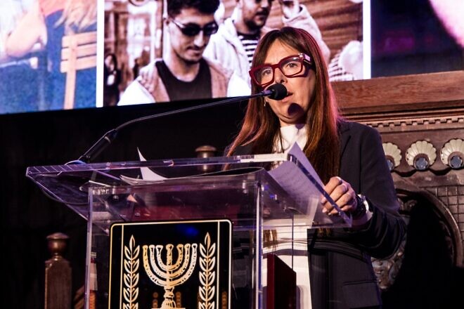 Ayelet Samerano, whose 21-year-old son, Yonatan Samerano, was shot by Hamas terrorists and abducted by a UNRWA social worker on Oct. 7, 2023, speaks at a memorial, sponsored by the Israeli Consulate General in New York and the Israeli-American Council, at Park East Synagogue on Manhattan's Upper East Side on Oct. 28, 2024. Credit: Ohad Kab studio/Israeli Consulate General.