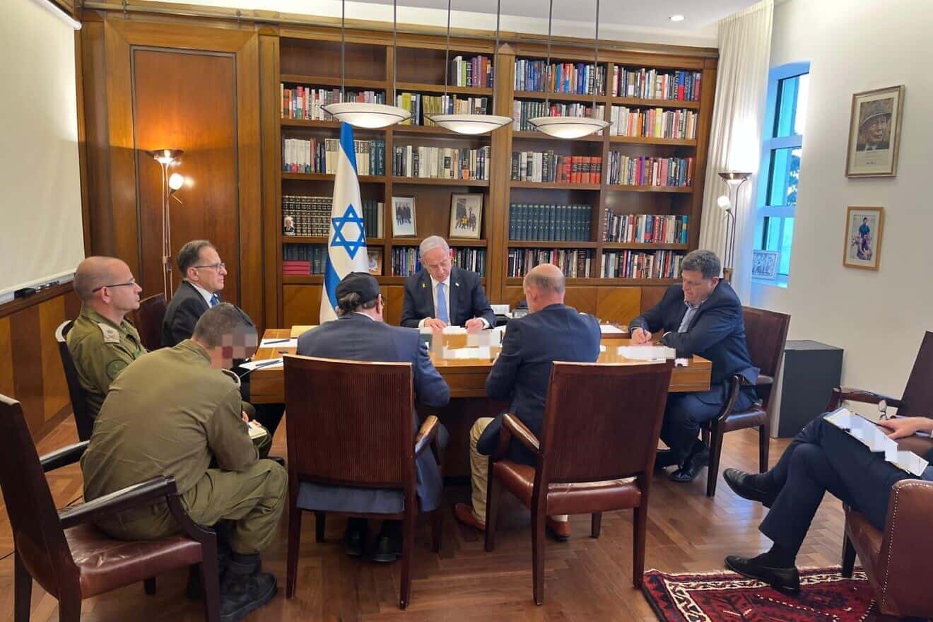 Israeli Prime Minister Benjamin Netanyahu, flanked by advisers, speaks to U.S. President Joe Biden on the phone. Oct. 9, 2024. Credit: Prime Minister's Spokesman's Office.