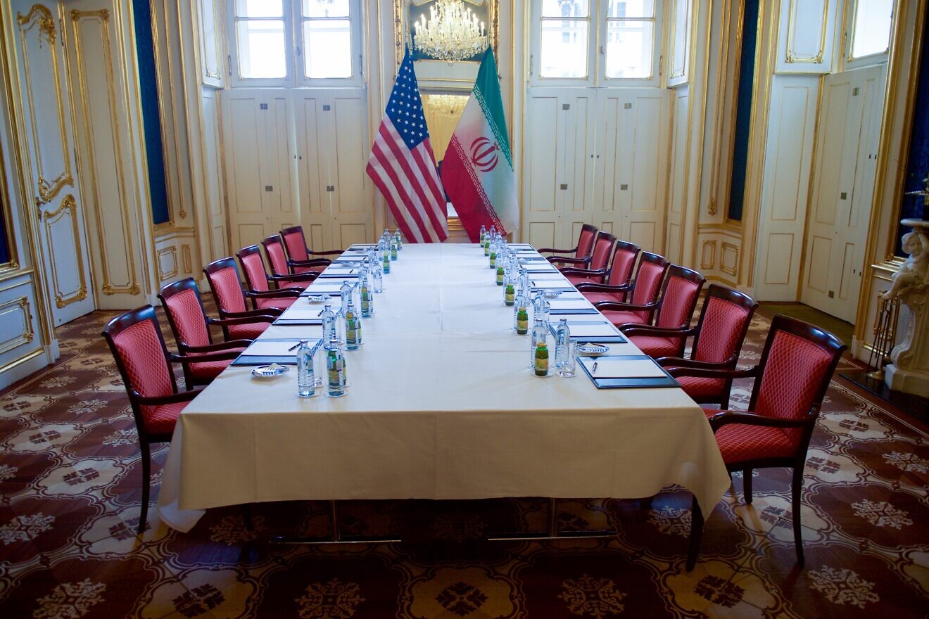 A meeting table in the Blue Salon of the Palais Coburg Hotel in Vienna, Austria, awaits U.S. Secretary of State John Kerry and Iranian Foreign Minister Javad Zarif before their meeting on Jan. 16, 2016, about the implementation of the Joint Comprehensive Plan of Action outlining the shape of Iran's nuclear program. Credit: U.S. State Department/Public Domain.