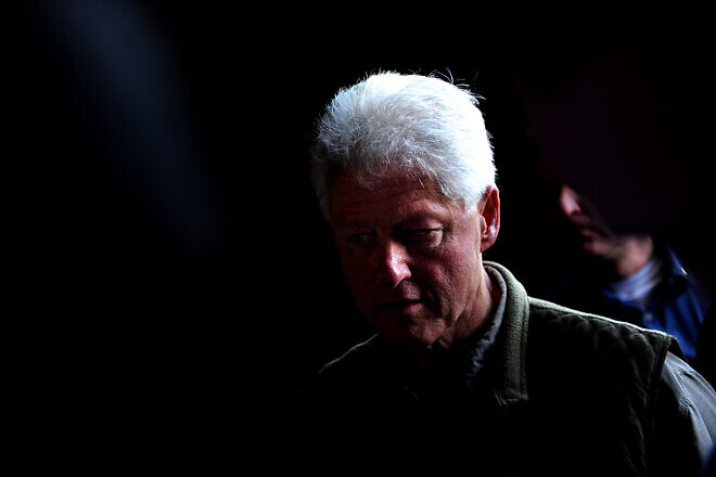 Former President Bill Clinton discusses the relief efforts with Col. Buck Elton, Commander, Special Operations Command South Forward-Haiti, Port au Prince, Haiti, Jan. 18, 2010. Credit: Master Sgt. Jeremy Lock/U.S. Air Force Photo.
