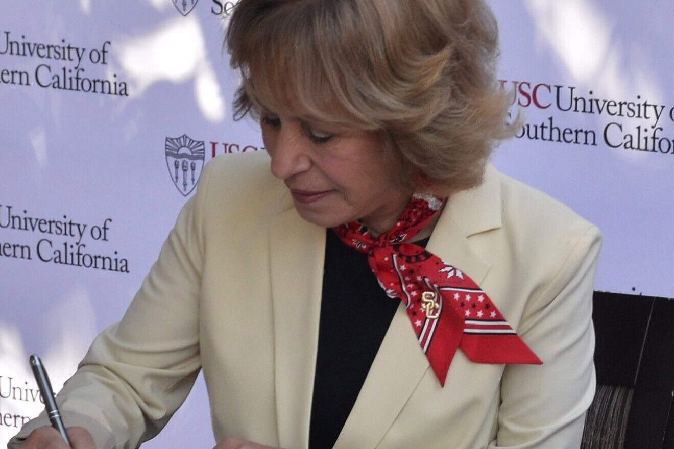 Carol Folt, president of the University of Southern California, signs a Memorandum of Understanding with the U.S. Space Force to begin a program to advance academic research in areas of technology and military service, Feb. 28, 2022. Credit: Jason Davidson/U.S. Space Force.