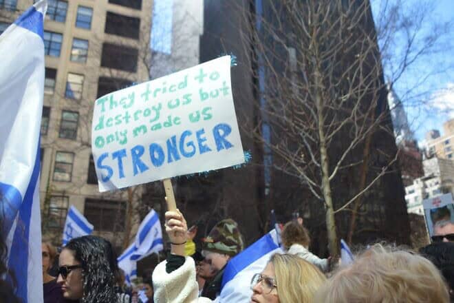 A woman holds a banner during a rally in New York City for Israel and the hostages. Photo by Faygie Holt.