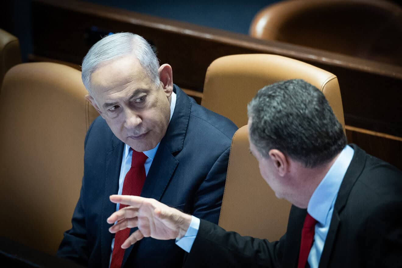 Prime Minister Benjamin Netanyahu speaks with then-Foreign Minister Israel Katz during a vote on the state budget at the Knesset in Jerusalem, March 13, 2024. Photo by Yonatan Sindel/Flash90.
